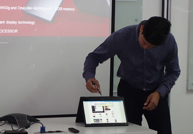 Lenovo product manager Francis Judan demonstrates the writing function on the new ThinkPad X1 Yoga